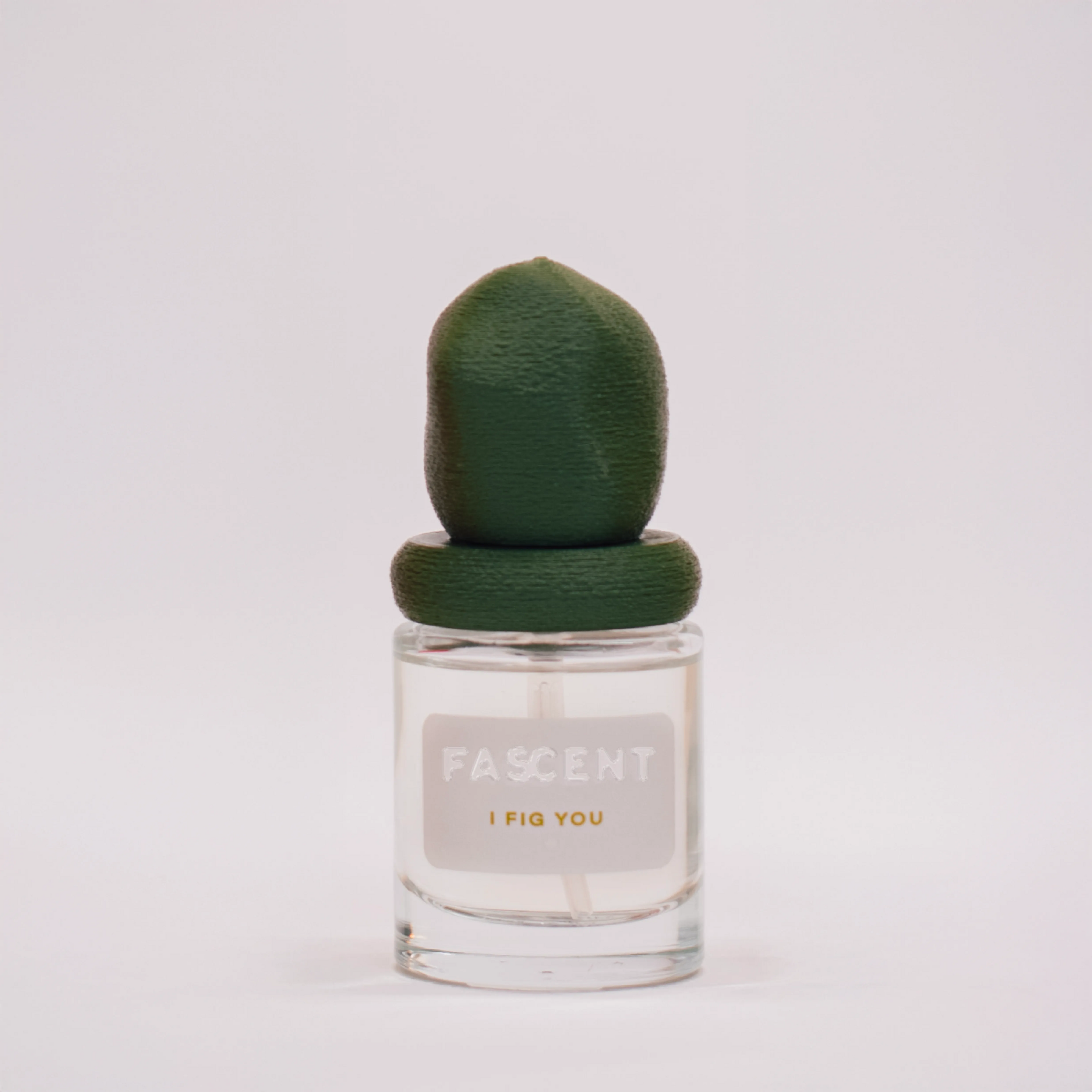 Flacon I Fig You de Fascent — parfum fruité-verdoie boisé, notes de thé vert, feuille de figue, agrumes, sauge, vé­tiver, bois de cèdre — alliance fraîche, végétale et soutenue pour un sillage naturel élégant