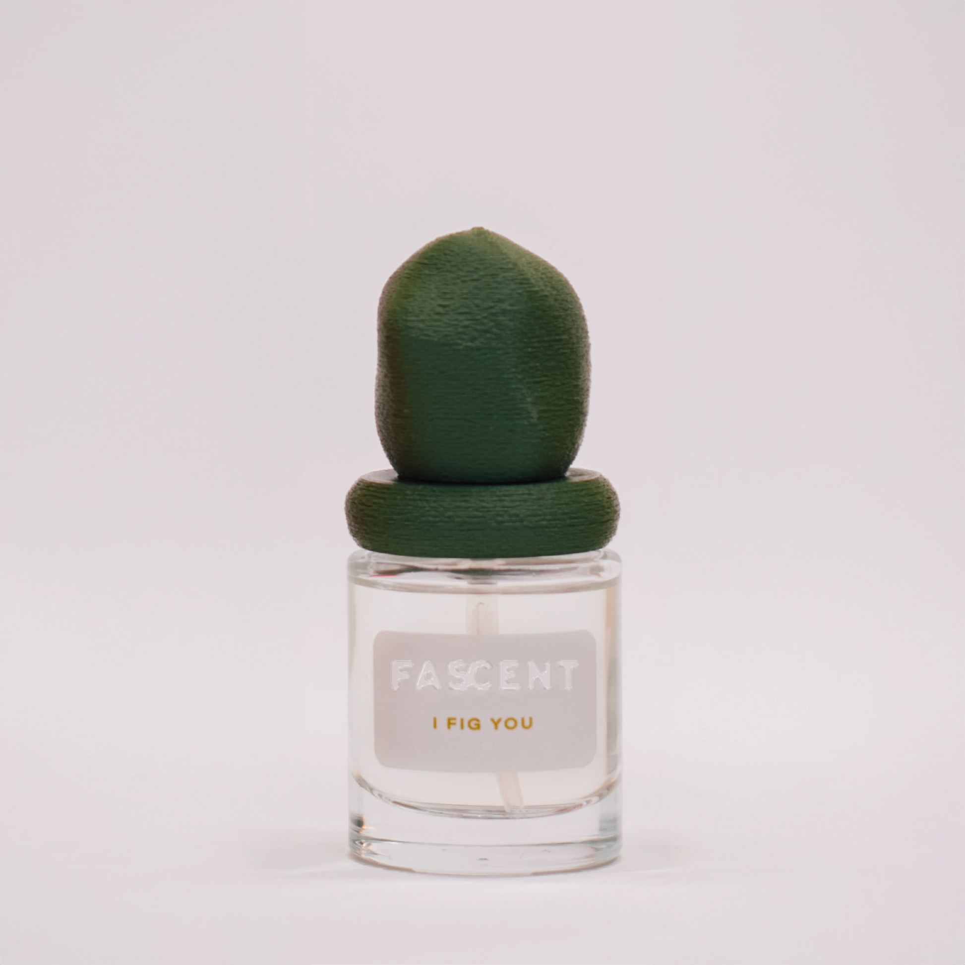 Flacon I Fig You de Fascent — parfum fruité-verdoie boisé, notes de thé vert, feuille de figue, agrumes, sauge, vé­tiver, bois de cèdre — alliance fraîche, végétale et soutenue pour un sillage naturel élégant