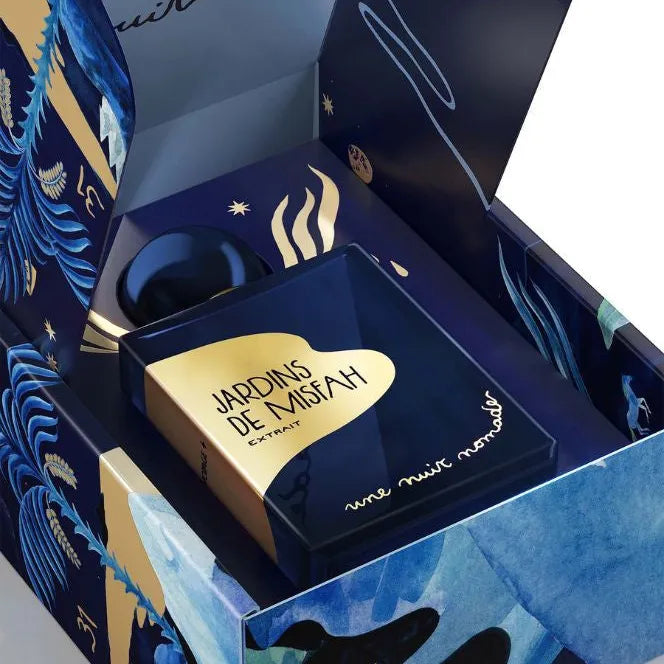 Flacon de parfums de niche Jardin de Misfah Extrait en bande dessiné avec un fond sombre bleu avec un palmier.