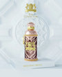 Flacon Morning Muscs d’Alexandre.J — parfum floral-fruité musqué unisexe mêlant mandarine, pamplemousse et pêche juteuse rehaussés d’une touche gourmande de caramel, un cœur riche de roses (Russie & Turquie), patchouli et violette, posé sur un fond doux de musc et mousse, évoquant une aube douce et lumineuse.