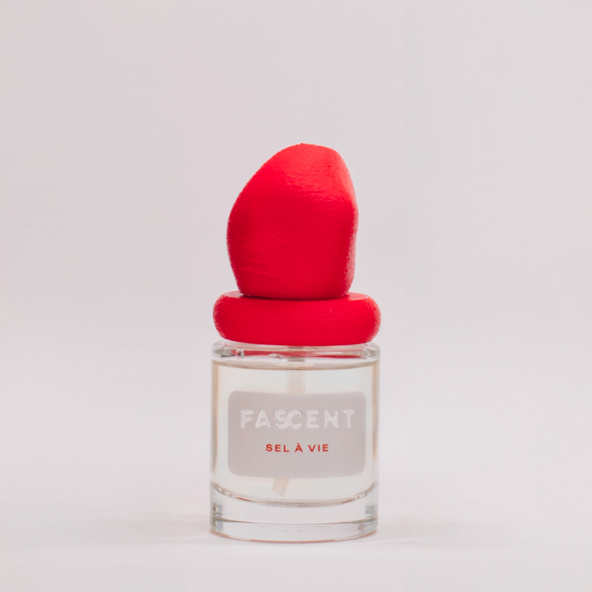 Flacon Sel à Vie de Fascent — parfum solaire et marin avec mandarine, orange douce, cœur floral exotique (ylang ylang, jasmin, tiaré), fond de sel de mer, bois flotté et vanille — ambiance plage ensoleillée et éclats d’été