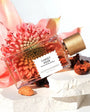 Flacon Sunset Hour de Goldfield & Banks — parfum gourmand fruité-boisé unisexe, mêlant pêche du désert, poire et mandarine en tête, cœur floral tropical de jasmin Sambac, mangue verte, gingembre, crème de noix de coco et poivre rose, sur fond chaud et enveloppant de bois de santal australien, vanille, cashmere wood, benjoin et musc.